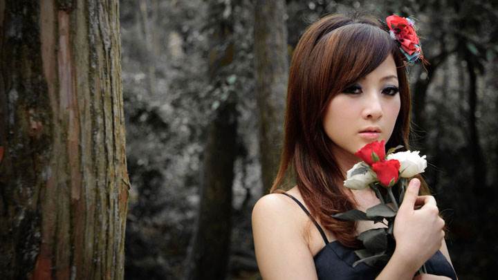 Asian Girl With Red And White Roses in Forest
